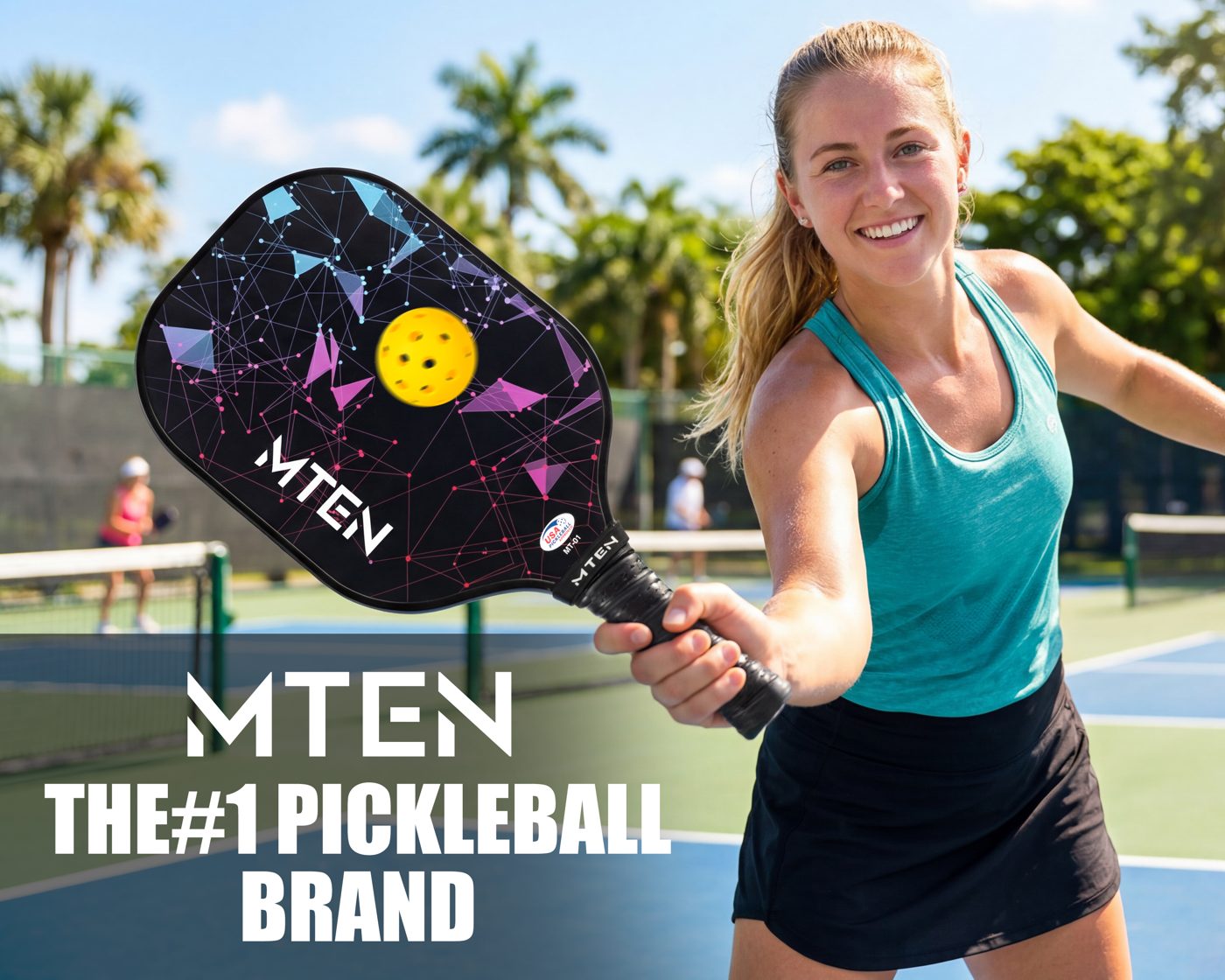 Player holding an MTEN night constellation pickleball paddle